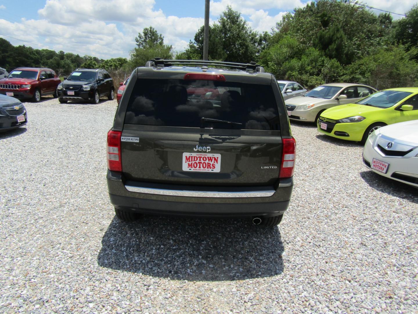 2015 Green /Tan Jeep Patriot (1C4NJPCB2FD) with an 4 CYL engine, Automatic transmission, located at 15016 S Hwy 231, Midland City, AL, 36350, (334) 983-3001, 31.306210, -85.495277 - Photo#6